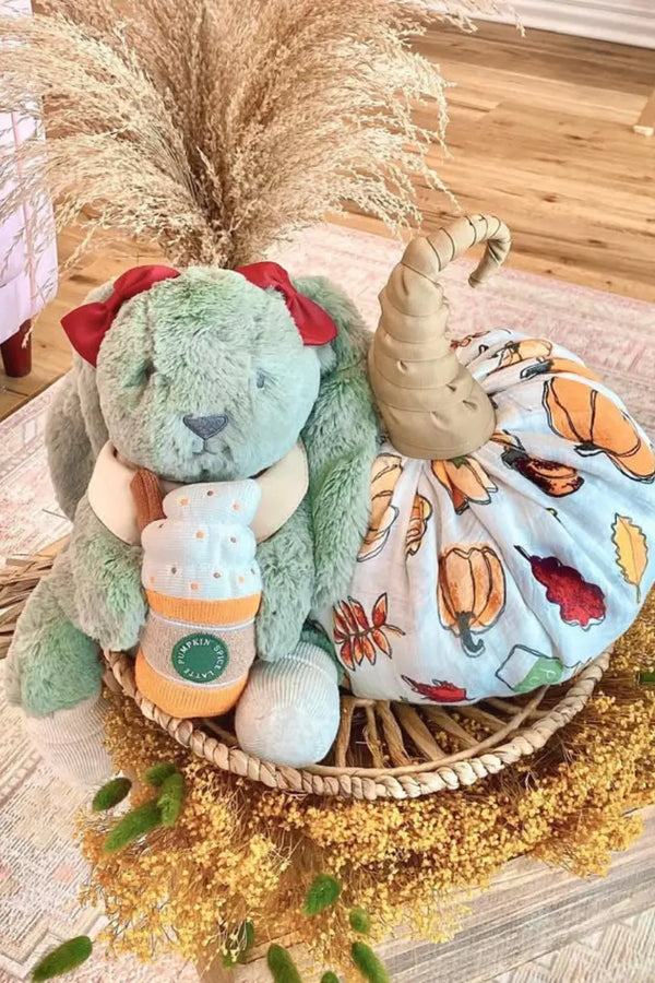  Diaper cake kits with preselected baby essentials, books, and colorful fabrics ready for easy assembly.
