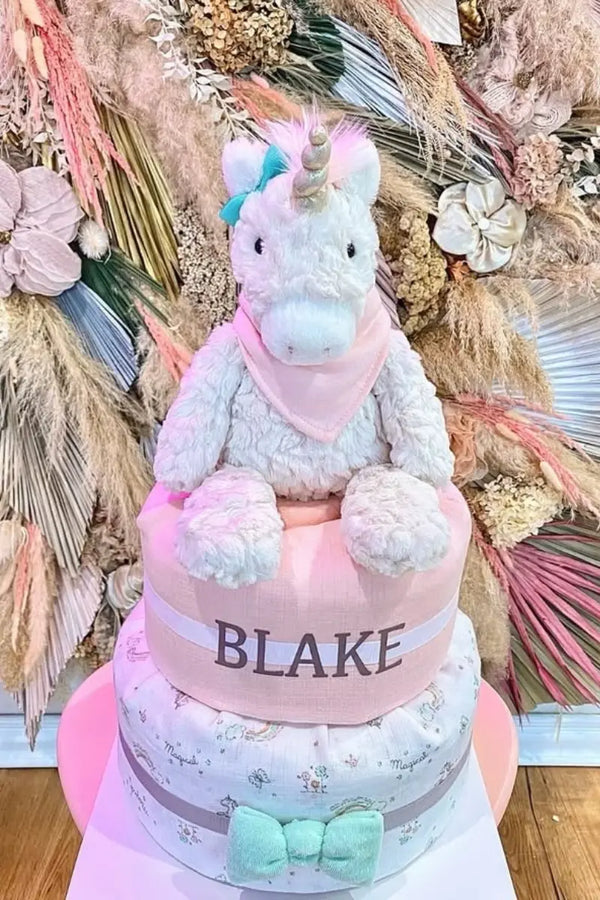 Diaper cake shop filled with creative, themed diaper cakes and plush toy gifts for baby showers.