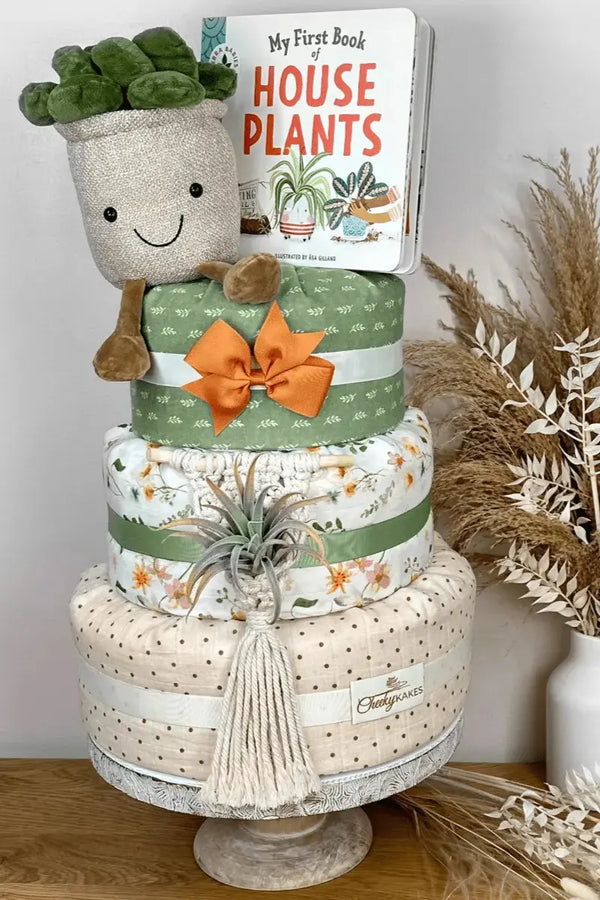Diaper wreaths featuring a creative display of rolled diapers, plush toys, and baby-themed decorations.